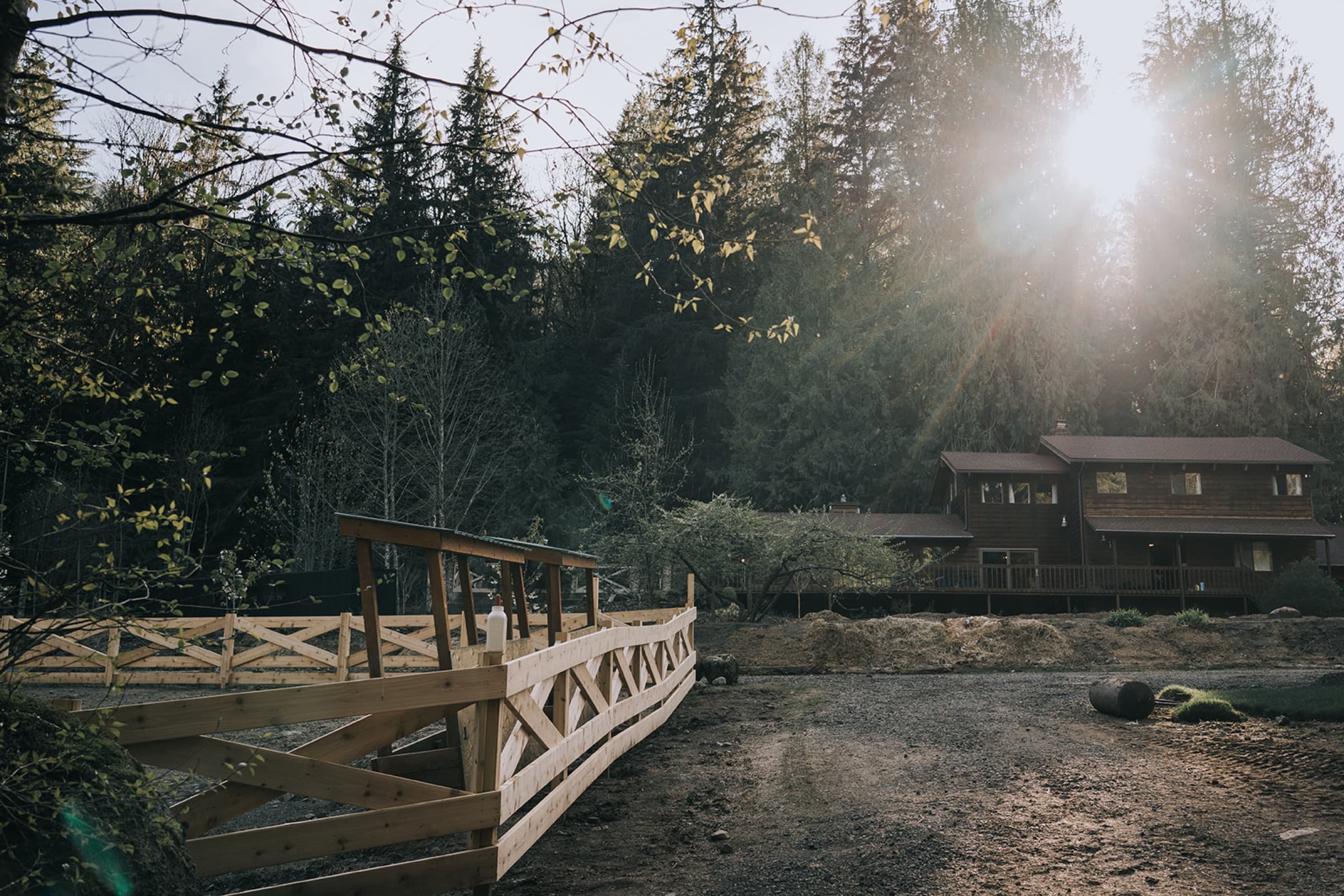 Lodge with wooden bridge at golden hour