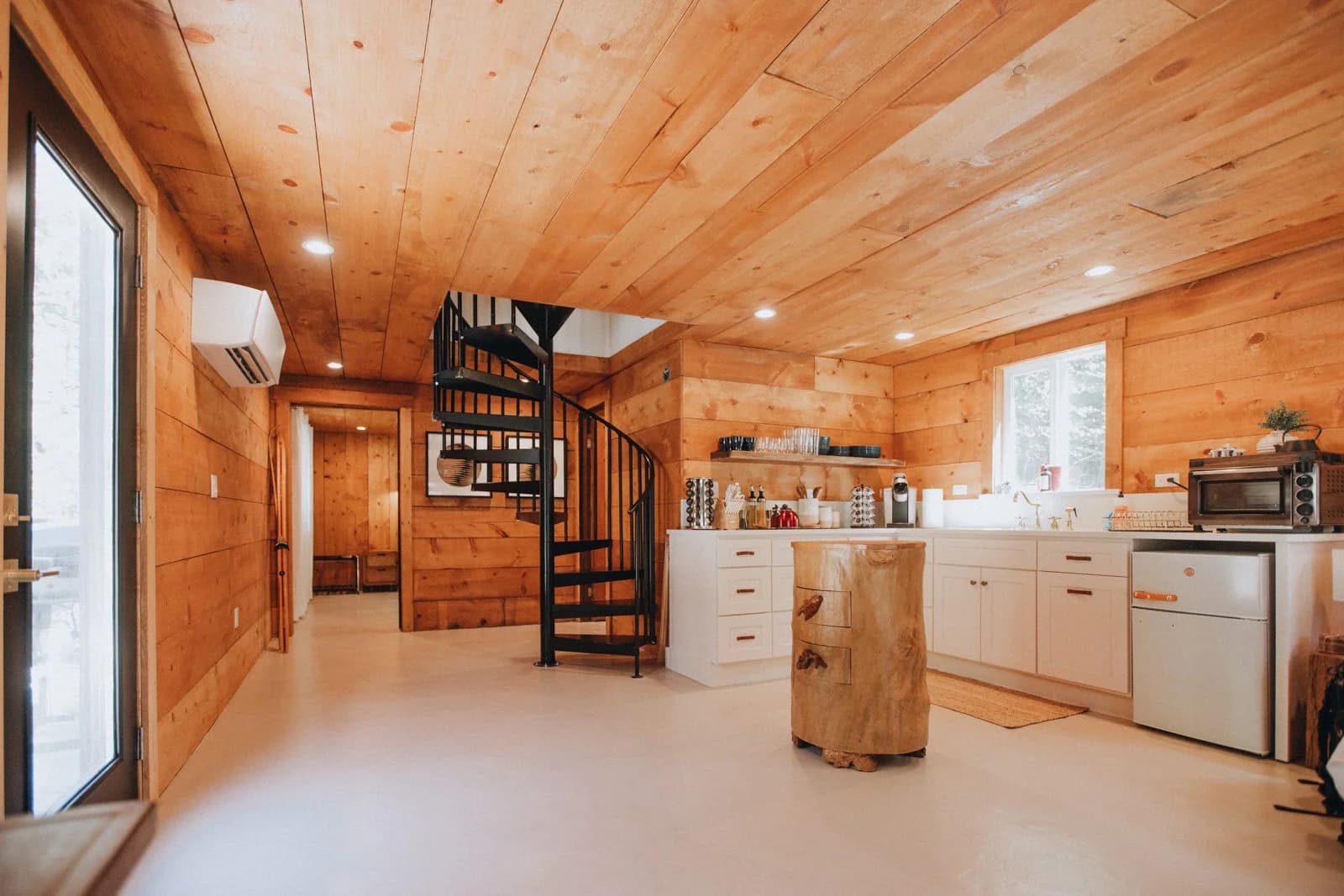 Kitchen with spiral staircase to loft