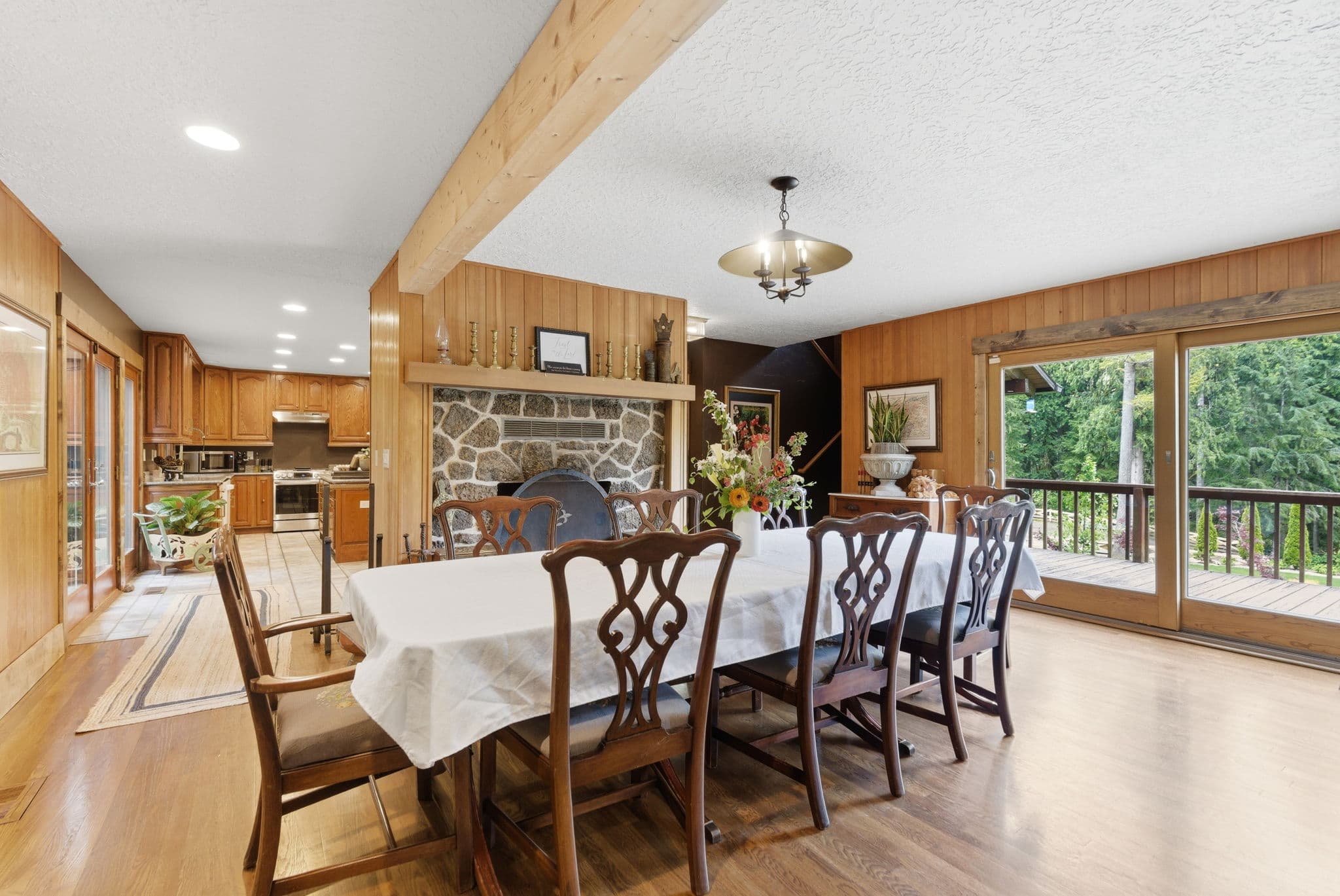 Formal dining room with stone fireplace and seating for ten