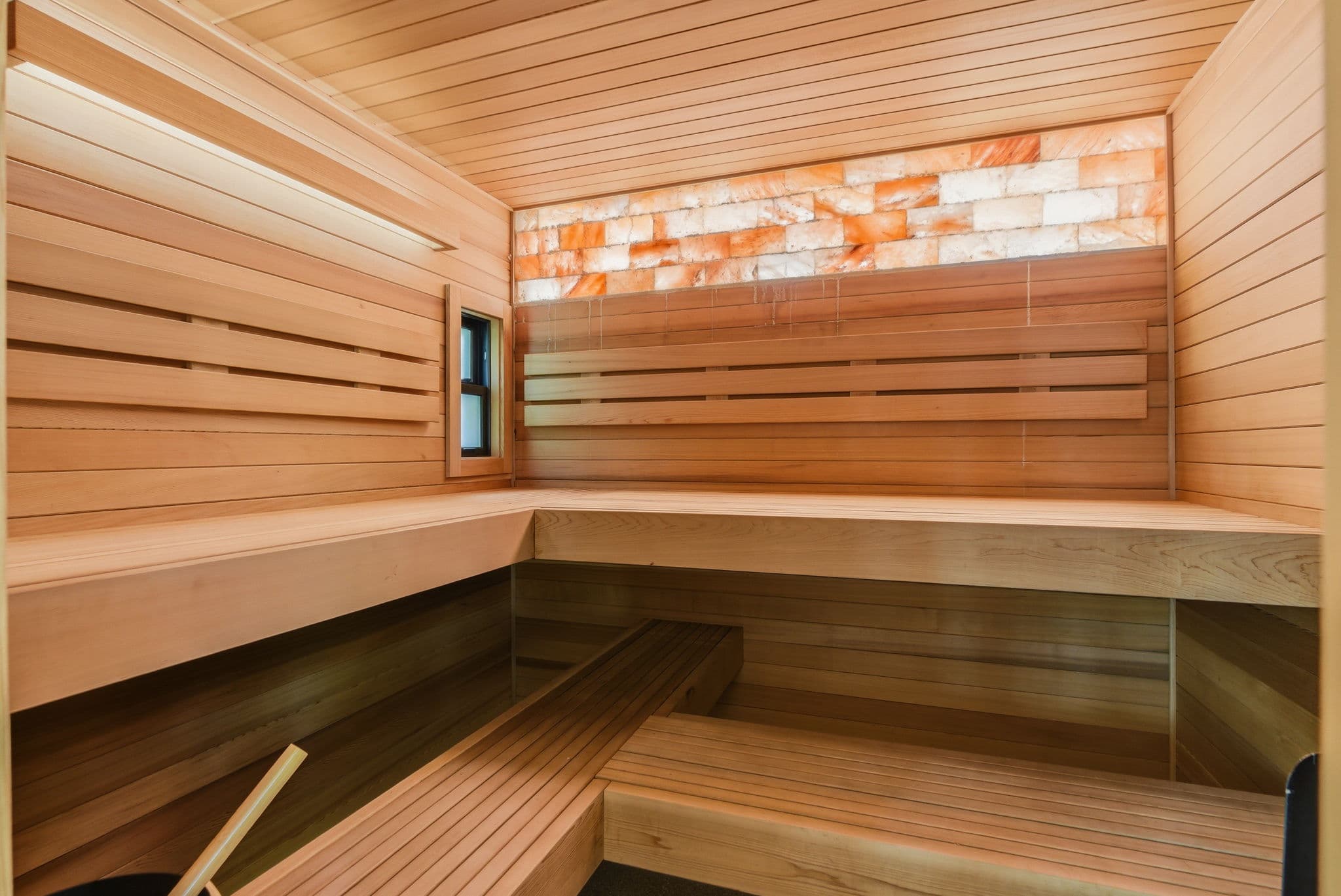 Cedar sauna interior with Himalayan salt-brick wall