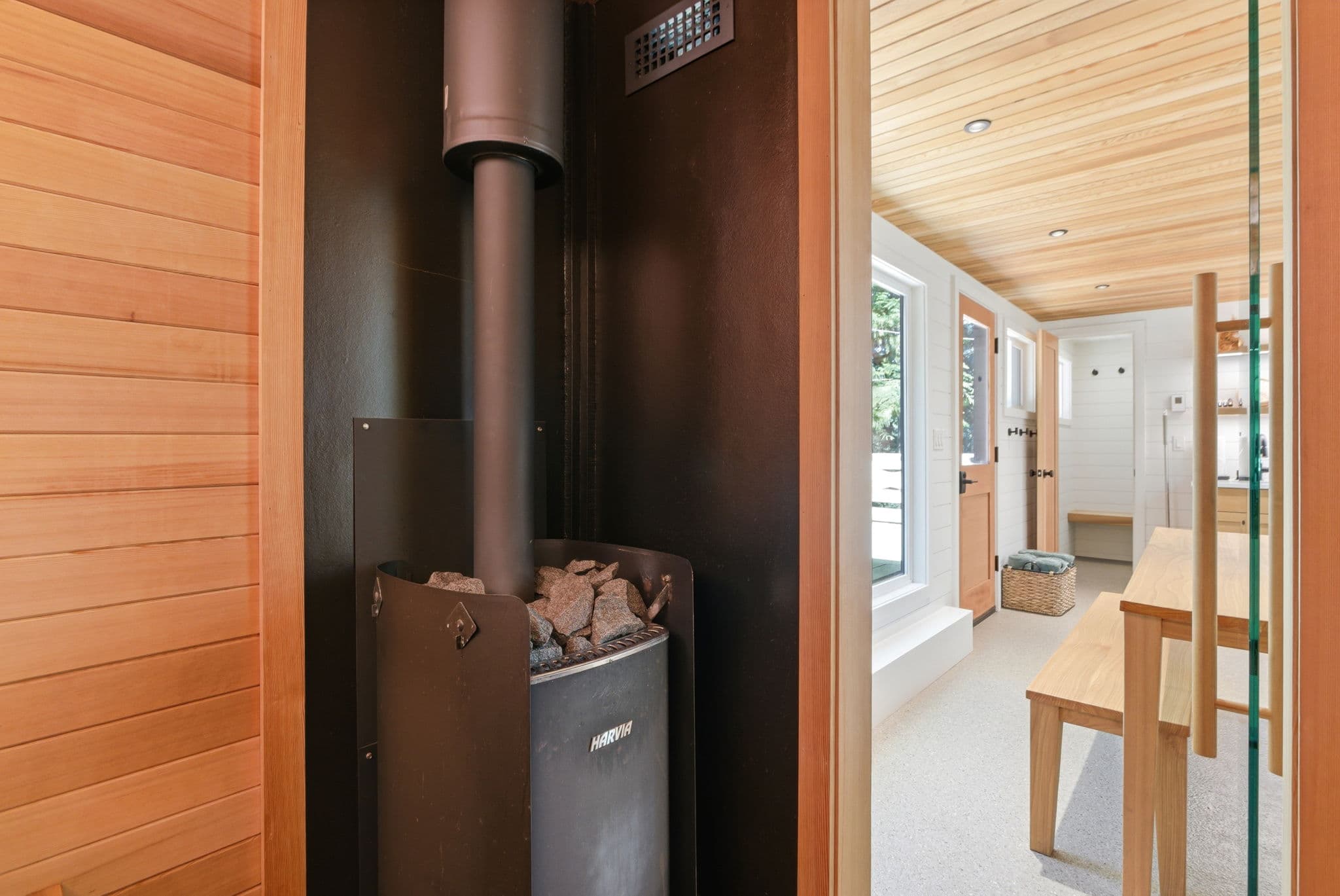 Harvia wood-burning sauna stove visible from the spa entry